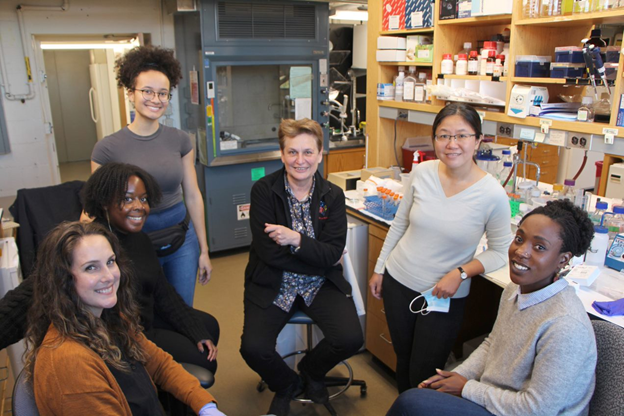 Catherine Dulac, PhD (center), of Harvard University, is honored with the Mika Salpeter Lifetime Achievement Award.