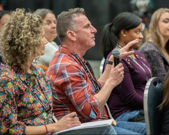 Attendees speaking with a microphone