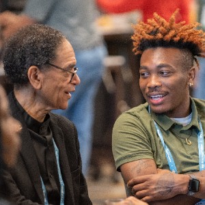 Annual Meeting attendees talking to each other