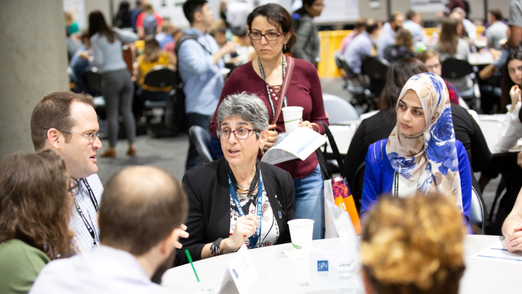 Neuroscience 2018 attendees sitting around a table at a training event