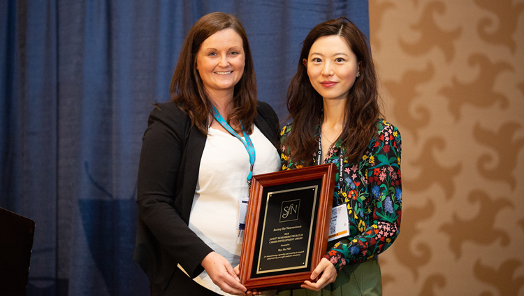 Biyu He, PhD, of NYU Langone Medical Center, accepts the Janett Trubatch Career Development Award.