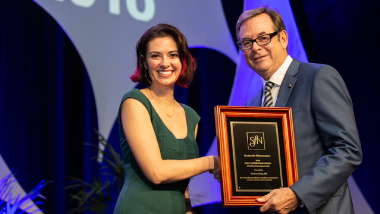 Teodora Stoica, MS, of the University of Louisville, accepts the Next Generation Award at the pre/postdoctoral level.