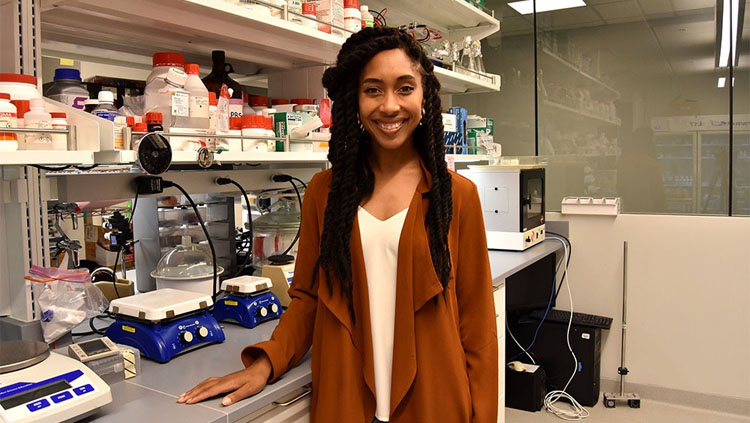 Image of Brielle Ferguson standing in a lab.